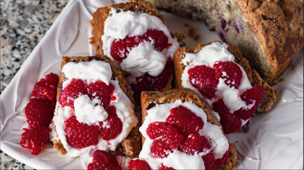 photo of blueberry buckle shortcake variation with whipped cream and raspberries